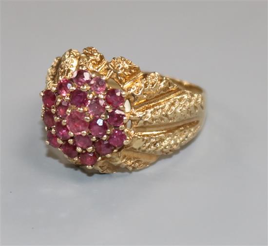 A modern 9ct gold and ruby cluster dress ring, size S.